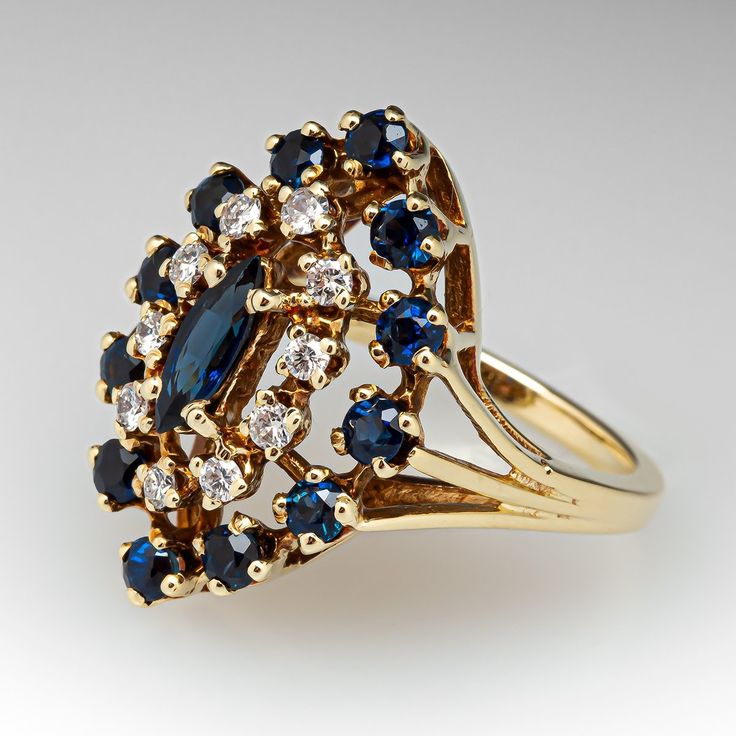 a gold ring with blue and white stones