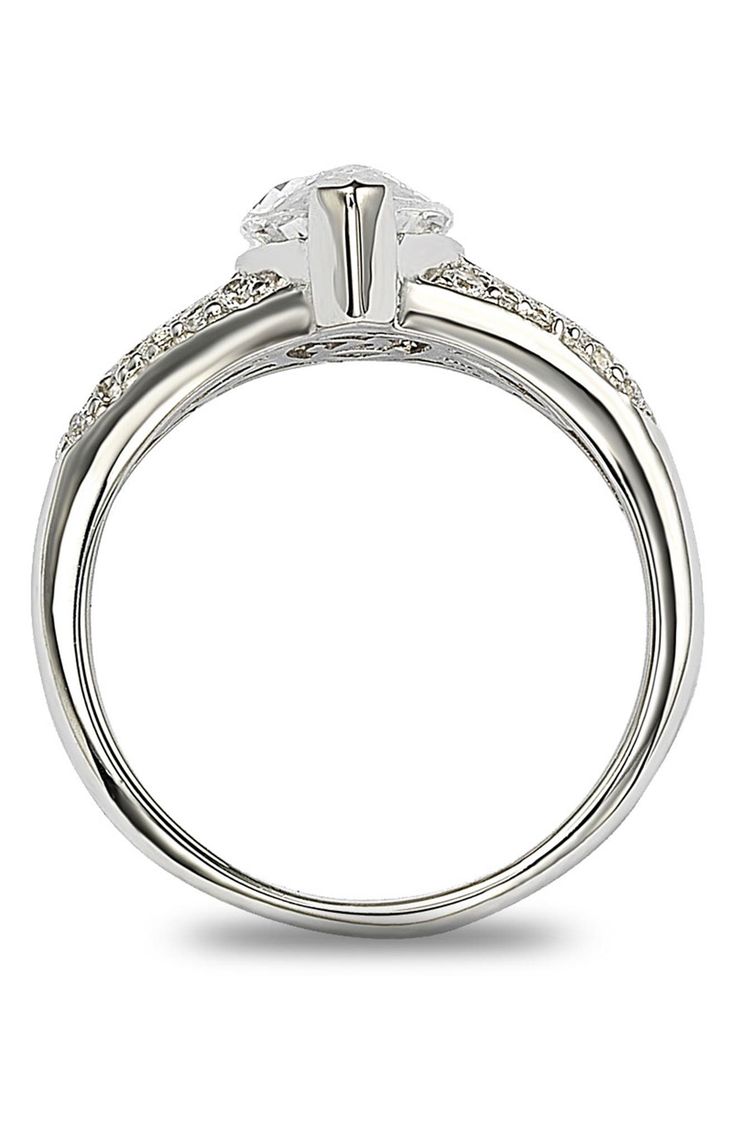 - Sterling silver white marquise cut CZ center gemstone with round CZ accents ring . Approx. 15mm L x 18mm W ring face. Imported Sterling silver, cubic zirconia Modern Jewelry With Marquise Cut Center Stone, Modern Solitaire Cubic Zirconia Rings, White Gold Cubic Zirconia Crystal Ring For Promise, Modern Crystal Ring With Cubic Zirconia, White Gold Crystal Ring With Diamond Accents For Promise, Promise Cubic Zirconia Crystal Ring In Fine Jewelry Style, Modern Diamond Crystal Ring With Vs Clarity, Marquise Cubic Zirconia Diamond Ring In White Gold, Silver Solitaire Cubic Zirconia Ring