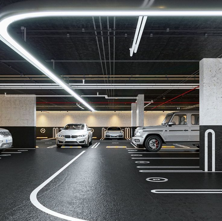 an underground parking garage with several cars parked in it