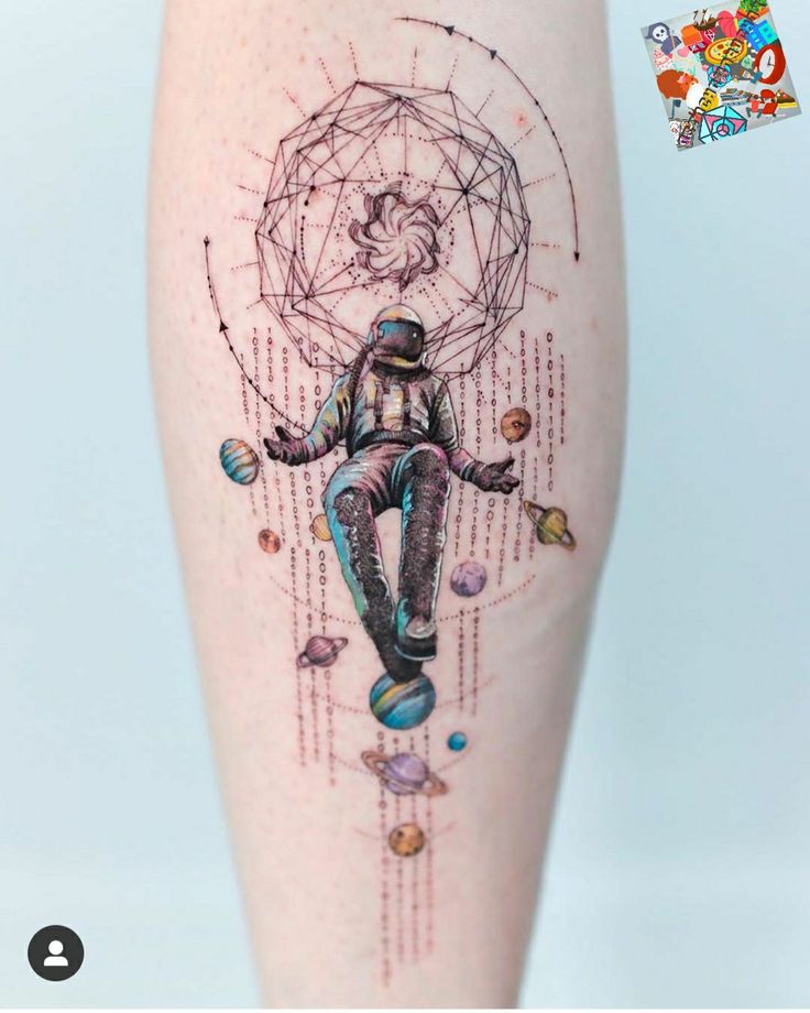 a tattoo on the leg of a person with an image of a man in space