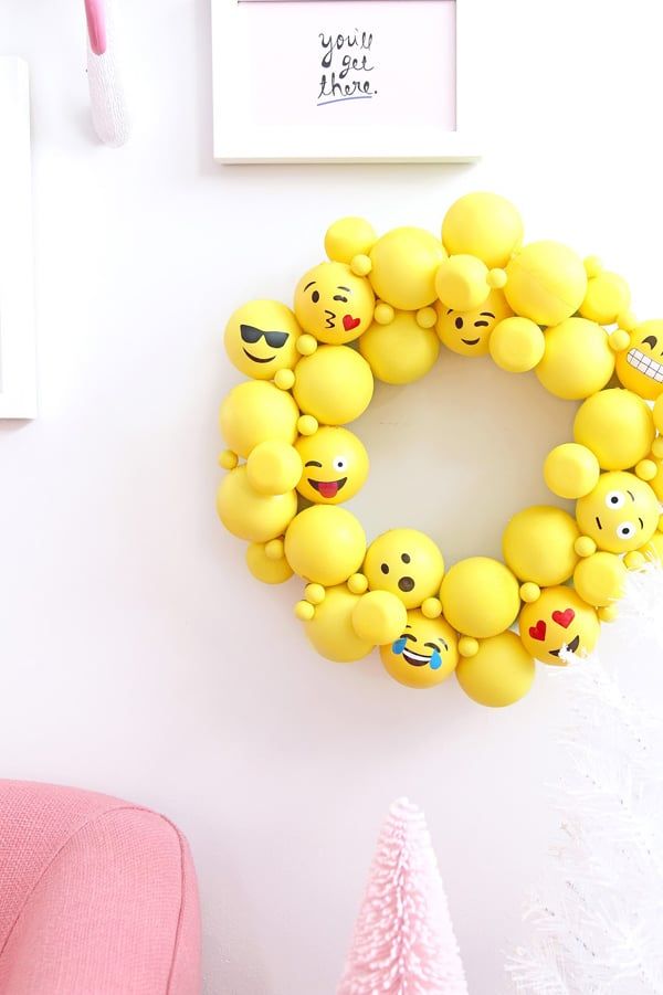 an image of a yellow wreath with emoticions on it and the words photo