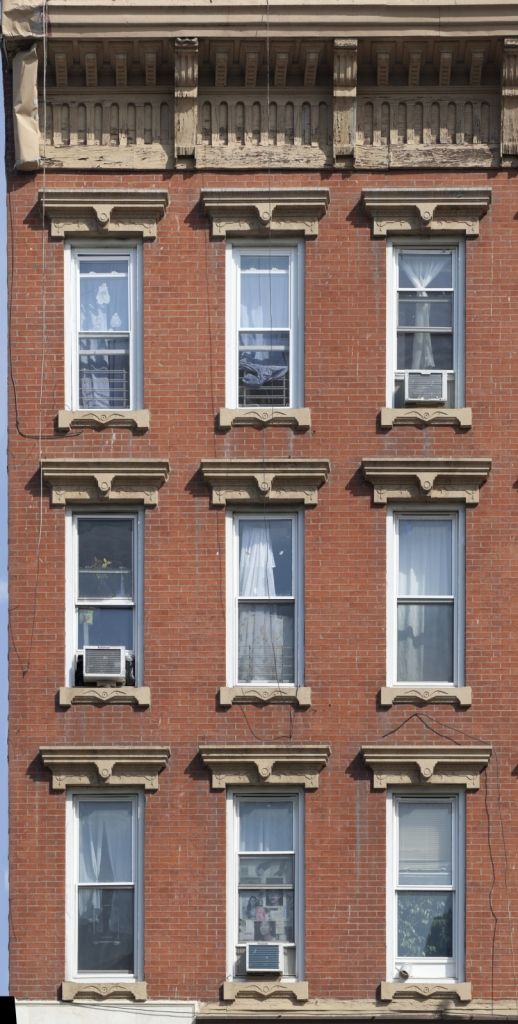 a tall brick building with many windows