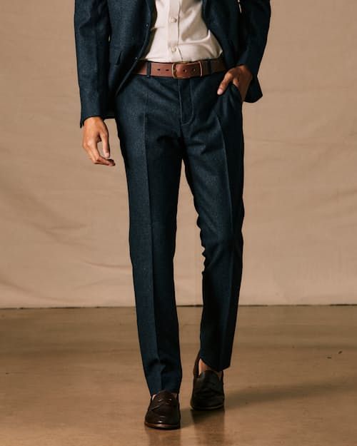 A simple yet sophisticated take on the classic wool trouser Slim Fit Dress Pants For Fall, Fitted Fall Suit Trousers, Wool Dress Pants For Fall Workwear, Classic Wool Suits For Business Casual, Classic Wool Suit For Business Casual, Timeless Wool Suits For Business Casual, Slim Fit Semi-formal Pants For Fall, Slim Fit Business Pants For Fall, Business Slim Fit Pants For Fall