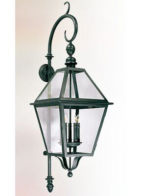 an old fashioned lantern hanging on the wall