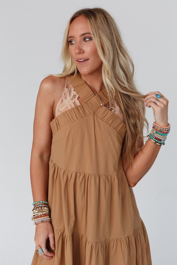 Whether you're dressing up for a special event or just want to add some boho flair to your everyday look, Sun Blissed Tiered Dress is sure to make a statement! This will become one of your go-to pieces because it features: Comfortable medium-weight woven stretch fabric Relaxed babydoll silhouette at a midi length Flattering halter neckline with gathered banded detail Gathered tiers throughout for added body and movement Perfect all-in-one outfit for any occasion! Effortlessly beautiful boho outf Hippie Dress For Spring Brunch, Bohemian Ruffled Boho Dress For Brunch, Bohemian Boho Dress With Ruffles For Brunch, Spring Festival Free-spirited Blouse, Free-spirited Spring Festival Blouse, Spring Boho Print Maxi Dress, Bohemian Ruffled Dress For Day Out, Spring Boho Print Blouse, Sleeveless Mini Dress For Beach In Fall