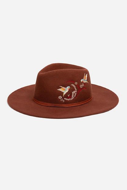 Crafted from 100% wool, the Hummingbird Heather Hat is available in an earthy rust color. Featuring a mid-height crown and a wide brim, this hat is finished with intricate placement embroidery and a decorative feather placed thoughtfully at the hatband. Style with a denim-on-denim look and western style boots for an eclectic ensemble. Johnny Was Women's Hummingbird Feather Hat in Rust Brown, Denim Brown Felt Hat With Flat Crown For Fall, Brown Felt Hat For Fall Rodeo, Brown Felt Hat For Rodeo In Fall, Fall Rodeo Brown Felt Hat, Brown Flat Crown Felt Hat For Spring, Brown Felt Hat With Curved Brim For Fall, Brown Fedora For Rodeo In Fall, Bohemian Wool Hat For Fall, Bohemian Wool Felt Hat For Fall