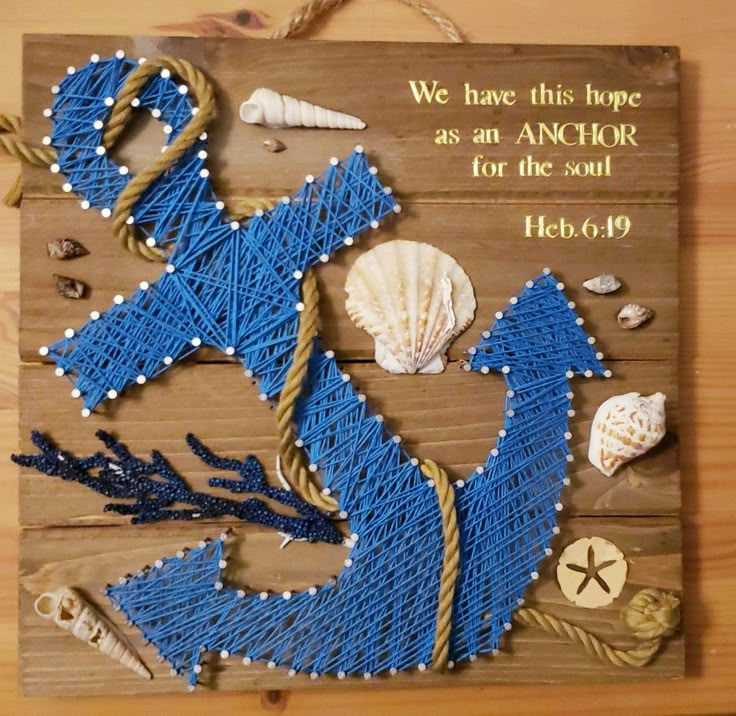 a wooden sign with string art on it that says we have this hope as an anchor for the soul