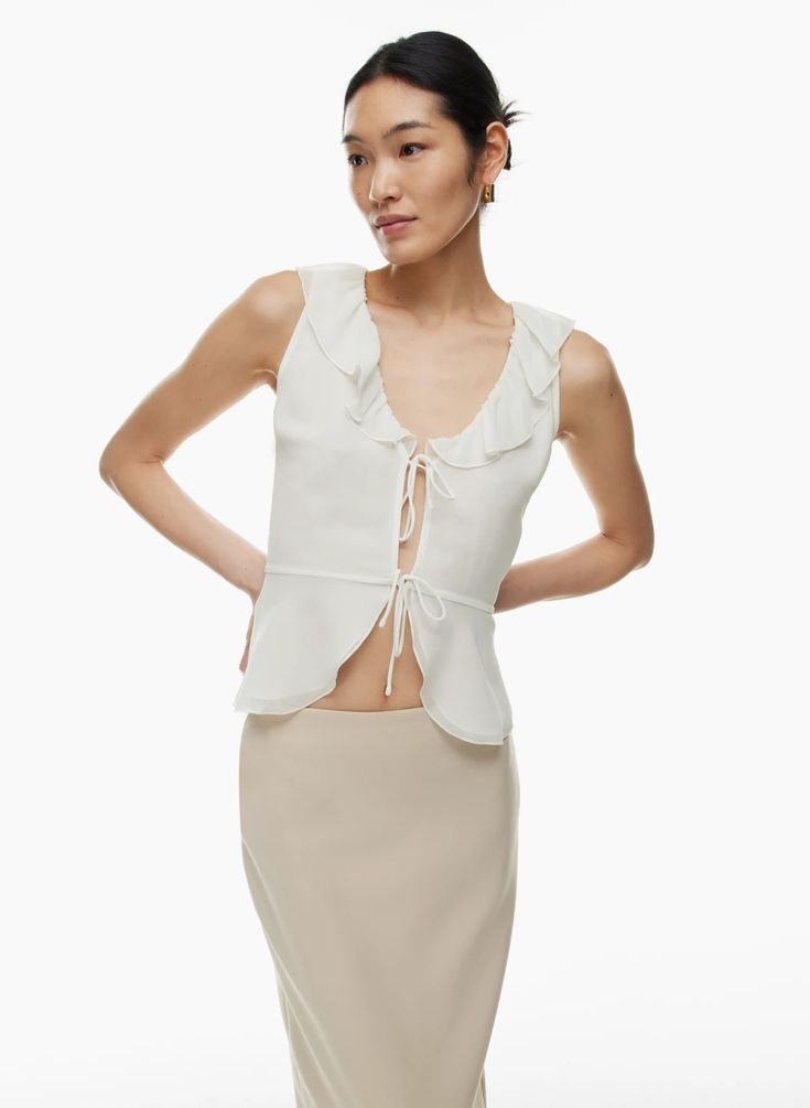 FLITTER BLOUSE | Aritzia V-neck Party Top With Ruffle Hem, Spring Chiffon Top With Ruffle Hem, Elegant Sleeveless Chiffon Blouse, Feminine Ruffled Blouse For Date Night, Summer Date Night Blouse With Ruffles, Spring Sleeveless Chiffon Blouse, Spring Chiffon Blouse With Ruffle Hem, Feminine Chiffon V-neck Top, Spring V-neck Flirty Blouse