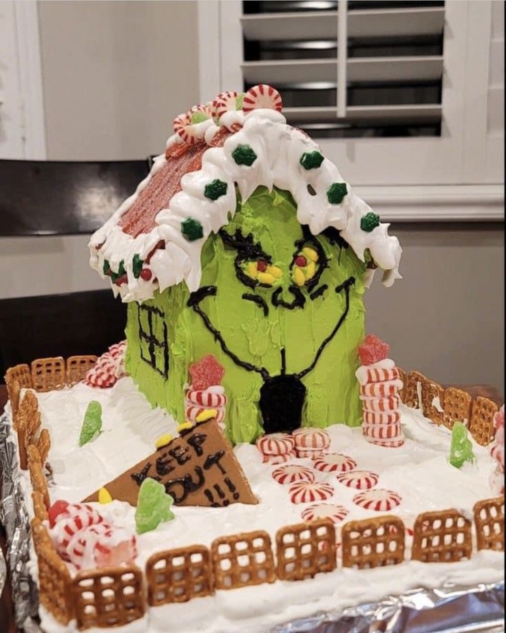 a decorated gingerbread house on top of a table