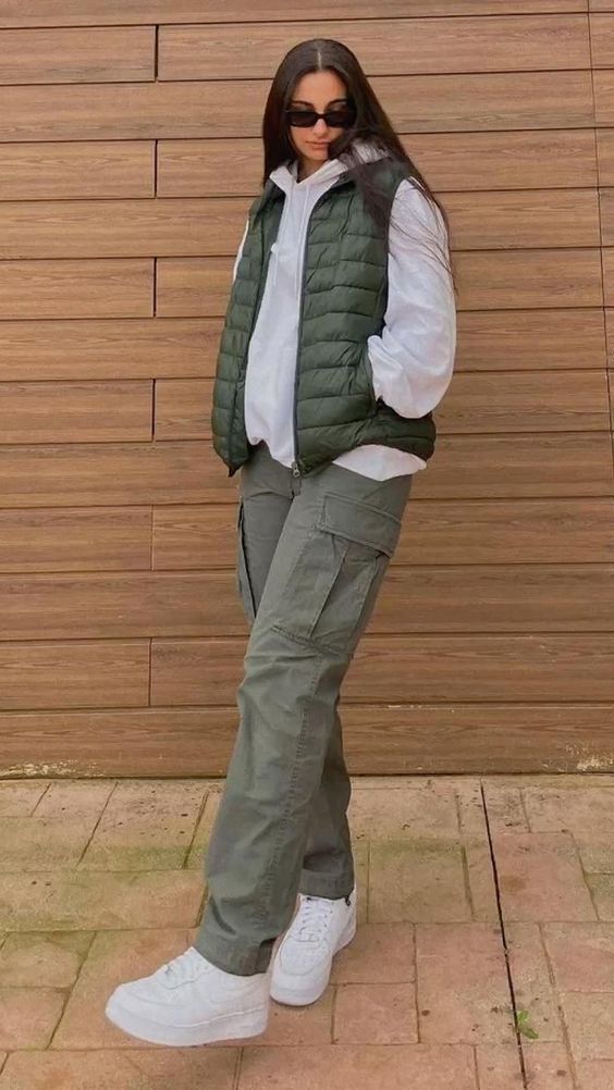 Nice Outfits Dressy Tomboy, Jeans And Vest Outfit Winter, Sweater Vest And Cargo Pants, Puffer Jacket With Cargo Pants, Puffy White Vest Outfit, Fall Fits Cargo Pants, Denver In October Outfits, Green Puff Vest Outfit, Ways To Style A Puffer Vest