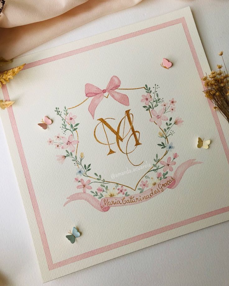 a card with the letter m on it next to some flowers and butterfly's