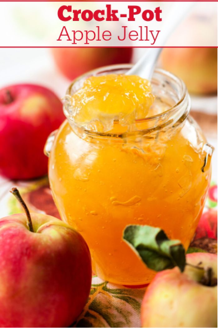 an apple jelly in a jar with apples around it and the words crock - pot apple jelly