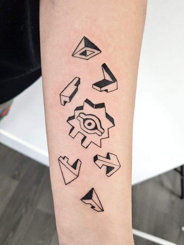 a person with a black and white tattoo on their arm that has geometric shapes all over it