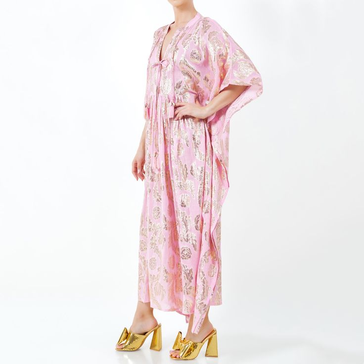 Crafted for the ultimate bohemian goddess, this ethereal maxi caftan combines comfort with effortless style. Ideal for leisurely days or chic outings, this playful dress features a deep V neckline adorned with four tassel shell embellished neckties, offering versatility whether worn open or closed.  This caftan is made from luxurious cotton lawn fabric in a soft pink hue with charming gold lurex flowers woven throughout. Its loose-fitting mu-mu style ensures comfort, making it perfect as a pools Cotton Lawn Fabric, Lawn Fabric, Flirty Dresses, Gifts For New Mums, Medium Dress, Alternative Wedding, Independent Designers Fashion, Bridal Collection, Country Club