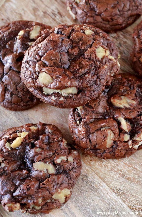 chocolate cookies with walnuts and sea salt on a cutting board, ready to be eaten