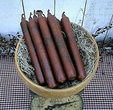 four hot dogs are in a bowl on a checkered tablecloth with an old clock