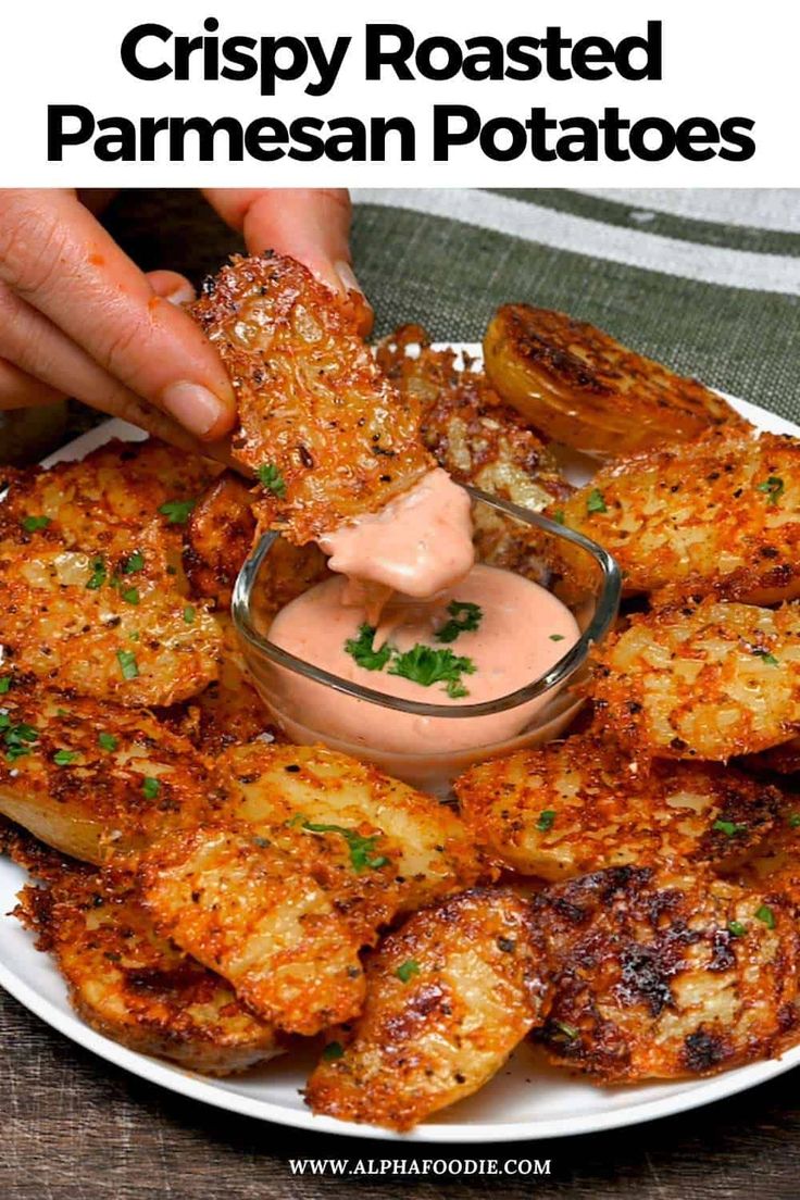 crispy roasted parmesan potatoes on a plate with dipping sauce