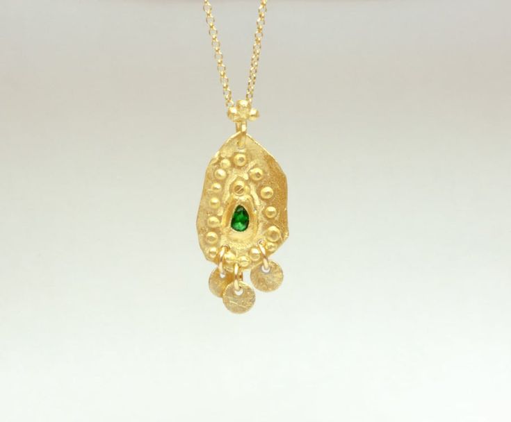 Boho gold necklace 9k 14 k Solid gold necklace with green emerald May birthstone, Yellow gold necklace, Delicate Pendant, Gift for her This solid gold necklace has a rustic textured and is set with a natural green emerald. The pendant has a delicate granulation all around it. This pendant is delicate but has a lot of character, and will upgrade any outfit you'll wear, for everyday use, as for special occasions The pendant can be ordered without the chain too. An excellent choice for anniversary Gold Plated Emerald Necklace In Fine Jewelry Style, Gold Plated Emerald Necklace Fine Jewelry, Fine Jewelry Gold Emerald Pendant Necklace, Yellow Gold Emerald Necklaces As A Gift, Gold Necklace With May Birthstone Gemstone, 14k Gold Pendant Necklace For May Birthstone, 14k Gold Necklace With May Birthstone Pendant, Gold Jewelry With Coin Pendant For May Birthstone, Gold Emerald Necklace As Gift