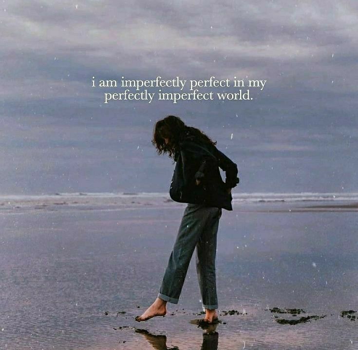 a woman standing on top of a beach next to the ocean with a quote above her that reads, i am perfectly perfect in my perfectly imperfecterfect world