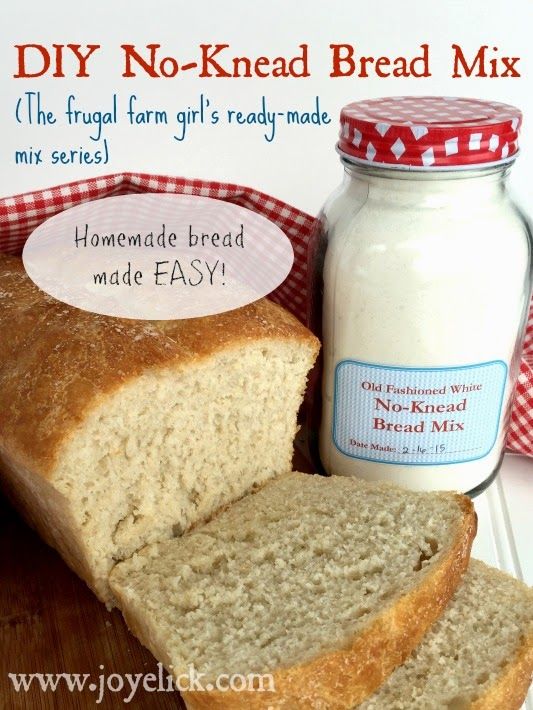 a loaf of bread sitting on top of a cutting board next to a jar of mayonnaise