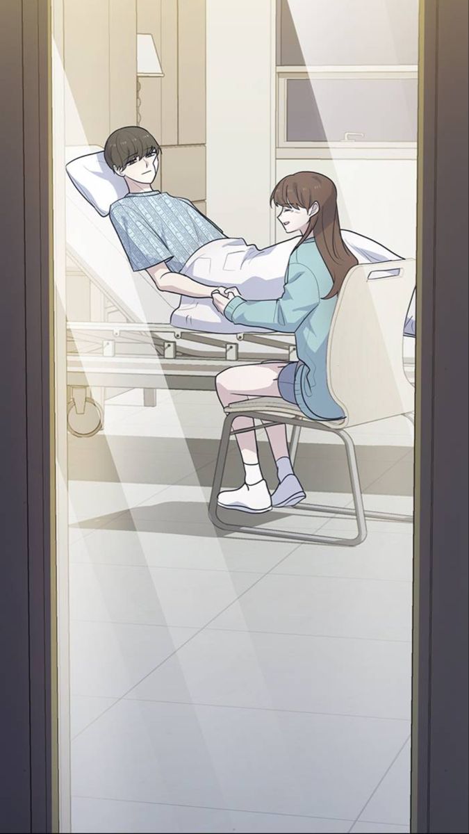 a woman laying in a hospital bed next to a man