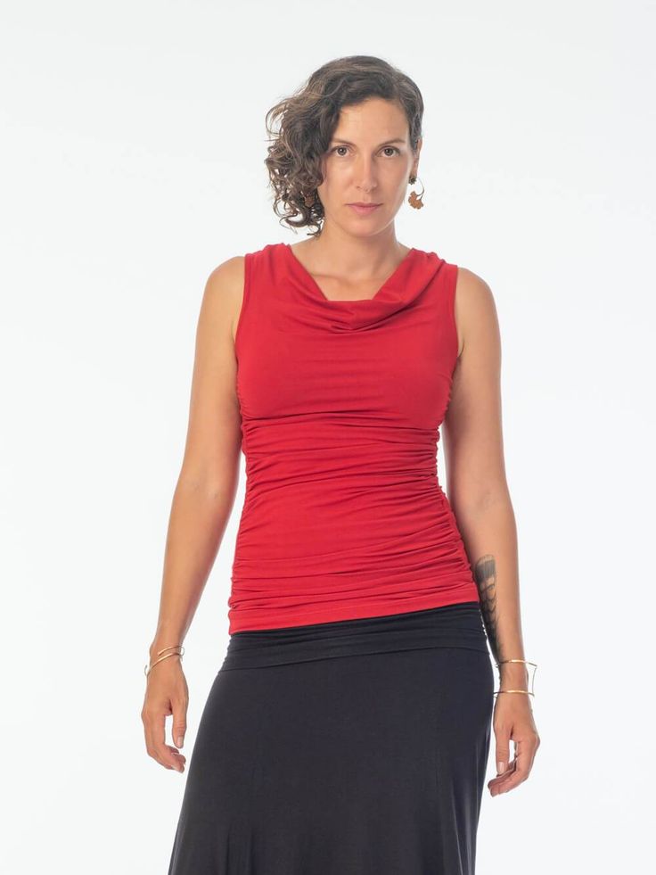 This top continually makes our list of best sellers for its comfy fit and stretchy fabric that hugs all the right places. Ruched side panels provide a flattering way to minimize extra tummy bumps and the slightly draped neckline is not cut too low. We recommend this top for casual work attire. [#details] Ruched side panels Size Suggestions S: 2-4 M: 6-8 L: 10-12 [/details] [#fabric] Rayon Lycra: 90% Rayon (Viscose) / 10% Spandex (Lycra) [/fabric] Flattering Stretch Sleeveless Top, Flattering Sleeveless Stretch Tops, Summer Tops With Ruched Sides And Elastane, Casual Sleeveless Top With Ruched Sides, Casual Fitted Top With Ruched Sides, Versatile Fitted Red Tops, Fitted Ruched Tops For Layering, Fitted Top With Ruched Sides, Versatile Foldover Top For Layering