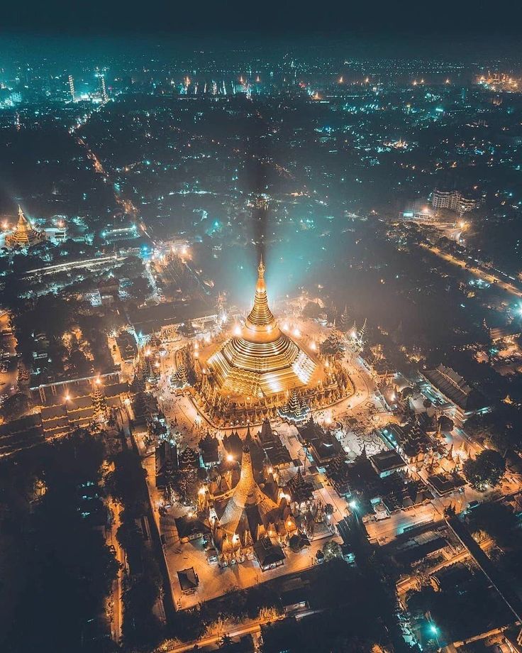 an aerial view of the eiffel tower lit up at night in paris, france