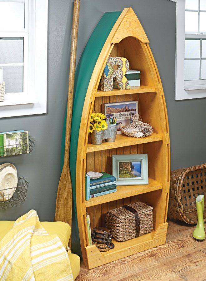 a wooden boat shaped book shelf in a room