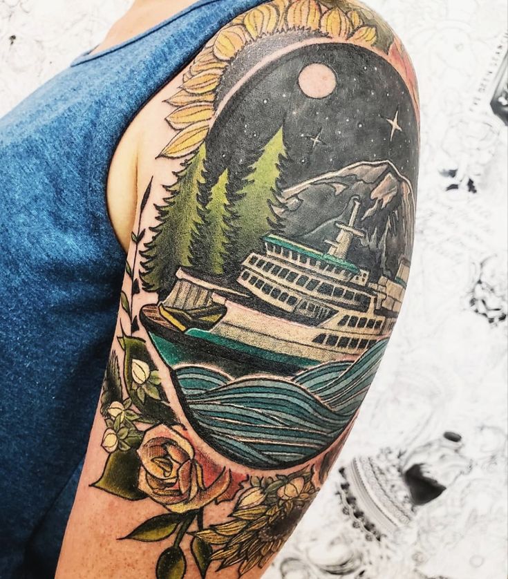 a man's half sleeve with a ship and trees on the back of his arm