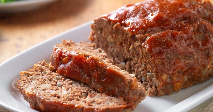 meatloaf with ketchup and lettuce on the side