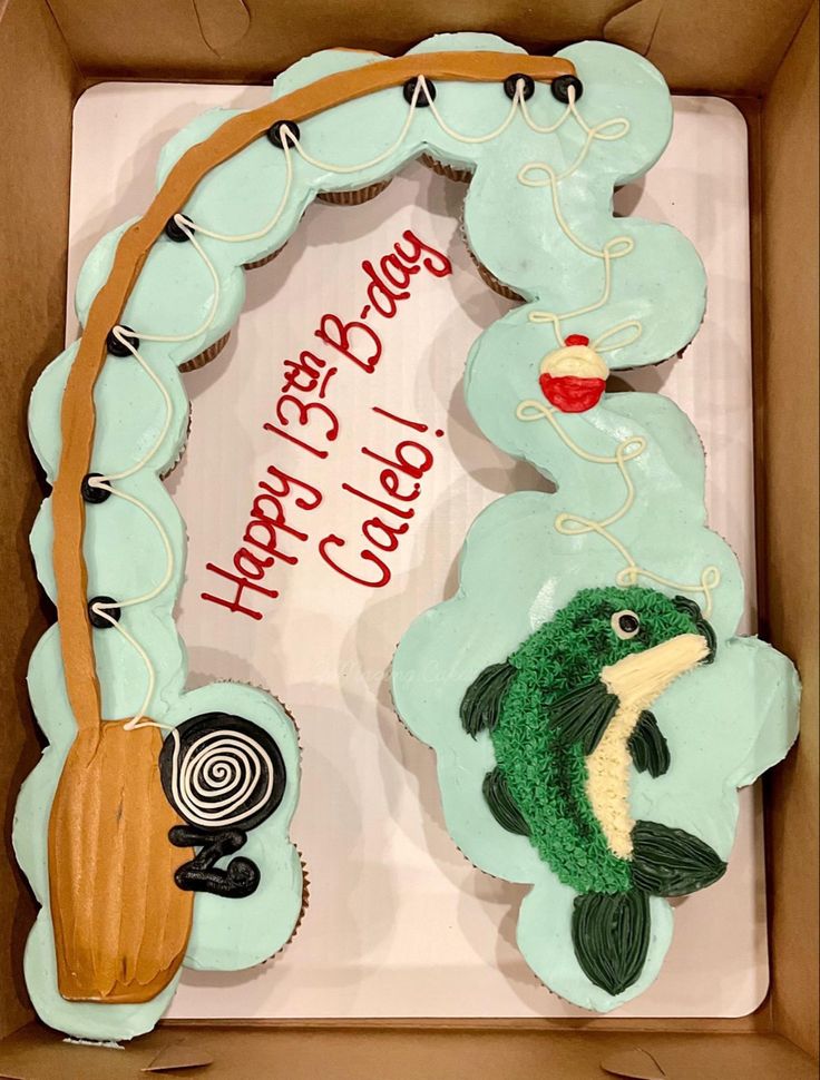 a birthday cake in the shape of a fish