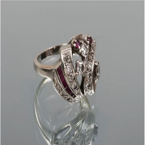 Impressive Vintage Designer Diamond and Ruby Size 4.5 Ring This lovely 14K white gold and diamond ring contains 18 round brilliant and single-cut diamonds weighing approx. .50 CTW and rated approx. VS-SI in clarity and H-I in color. 7 round and square faceted rubies weighing approx. .20 CTW make this ring really POP! Size: 4.5. Weight: 7.2 grams. It can be re-sized at your favorite jeweler. Only One AvailableA similar Ring Sells for $3,375 - 1stdibsPristine Condition - Guaranteed & CertifiedFree Exquisite Brilliant-cut Ruby And Diamond Ring, Exquisite Ruby Ring With Brilliant Cut Diamond, Cubic Zirconia Ring With 17 Jewels, Diamond White Ruby Ring With Diamond Accents, Platinum Ruby Ring With 17 Jewels, Classic White Gold Ruby Ring With Single Cut Diamonds, White Gold Ruby Ring With Single-cut Diamonds, White Gold Ruby Ring In Platinum, Elegant Ruby Ring With Single Cut Diamonds