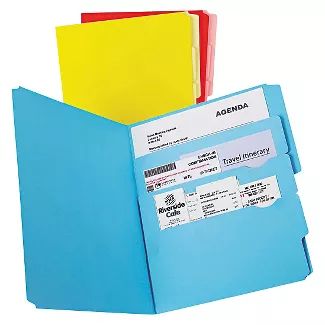 three folders are stacked together in an open file pocket, each with a name tag on the front