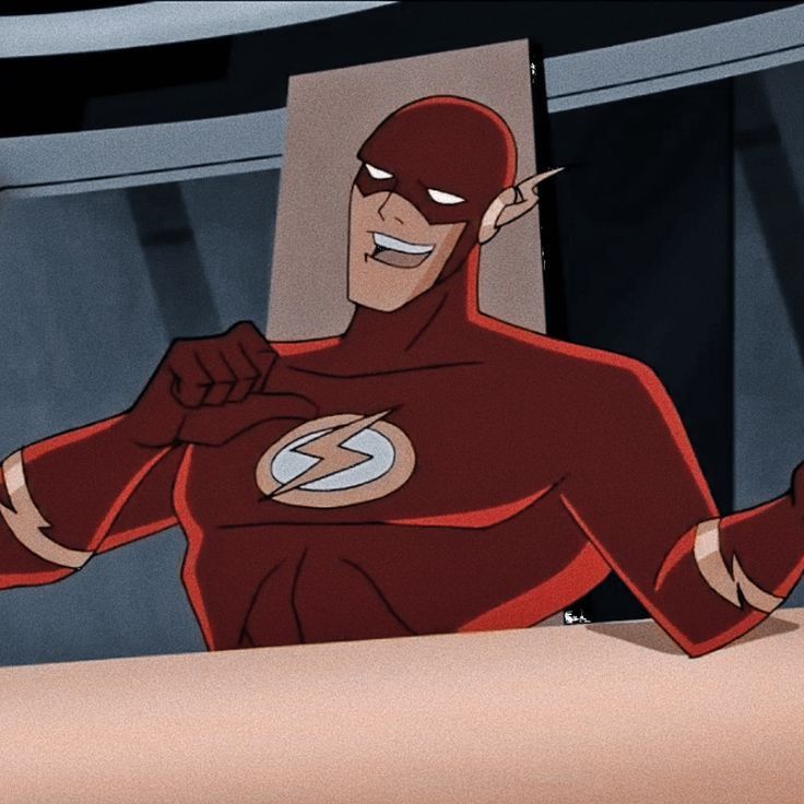 the flash is smiling and pointing at something