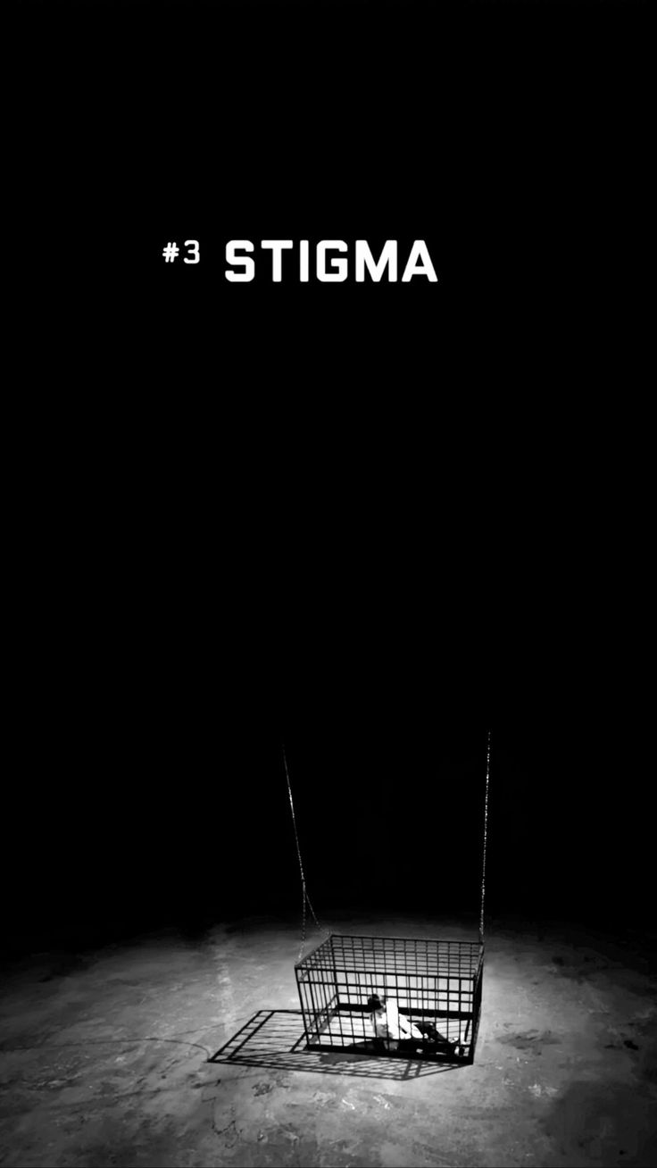 a black and white photo with the word stigma in front of an empty shopping cart