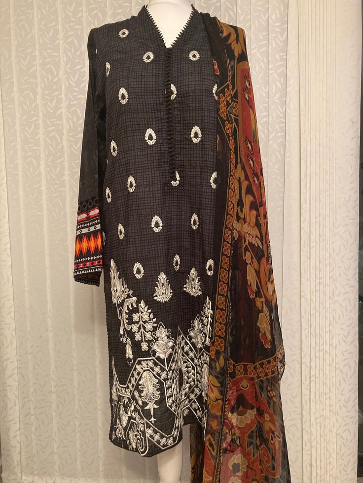 This 3pc suit is from junaid jamshed. Embroidery work done in kameez, dupatta is pure chiffon and trousers is cotton. Chest size is 42 Eid Kurta With Printed Motifs In Cambric, Eid Cambric Kurta With Printed Motifs, Multicolor Semi-stitched Cambric Lawn Suit, Long Sleeve Georgette Lawn Suit With Dupatta, Unstitched Cotton Lawn Suit With Printed Motifs, Unstitched Cotton Lawn Suit With Dabka, Printed Georgette Lawn Suit With Straight Kurta, Unstitched Georgette Churidar With Printed Motifs, Anarkali Lawn Suit With Printed Motifs In Georgette