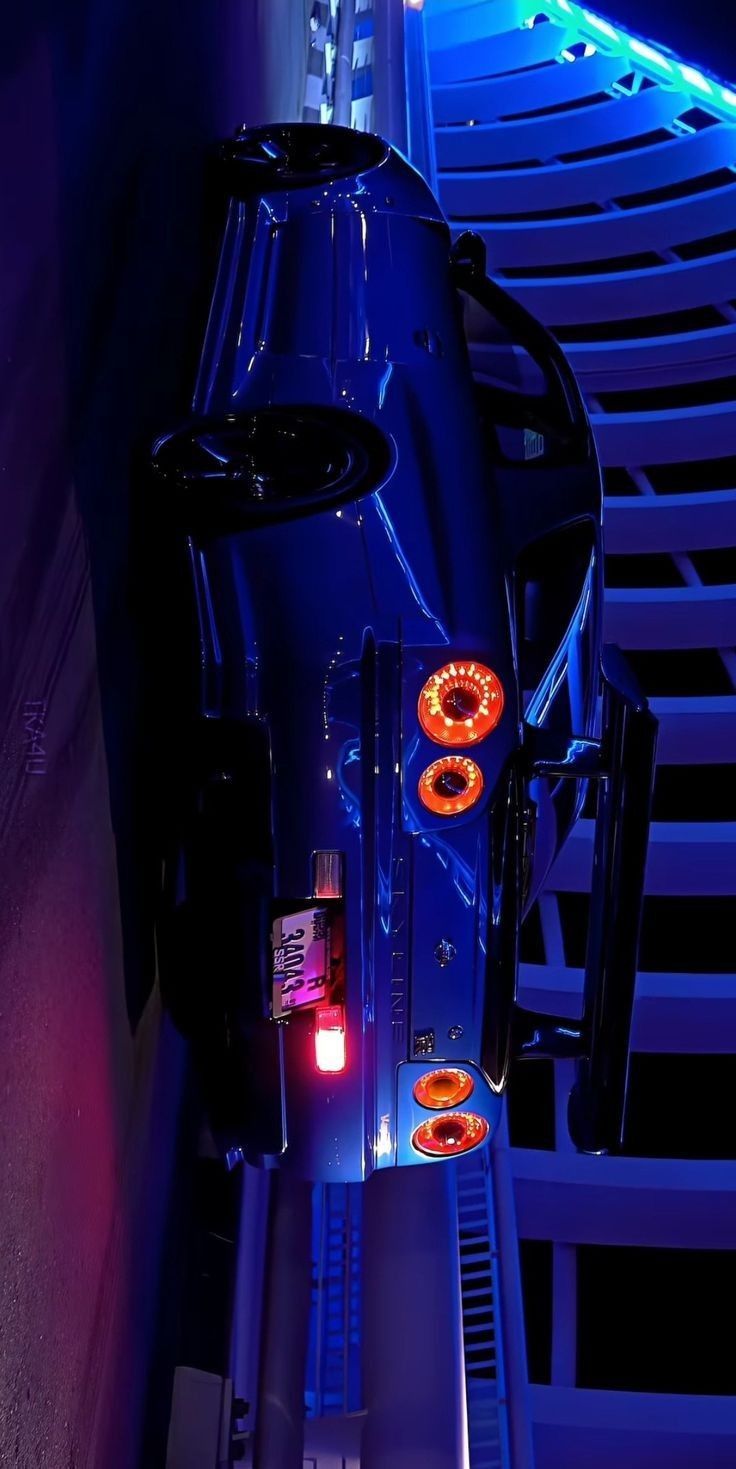 the back end of a car with its lights on