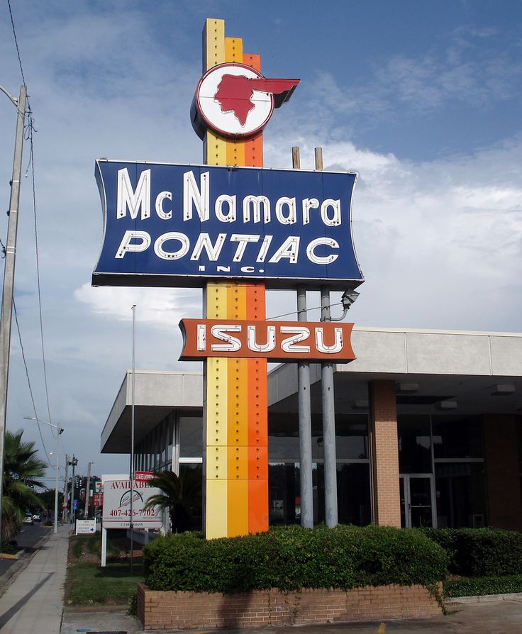 there is a sign that says mc namara pontac in front of the building