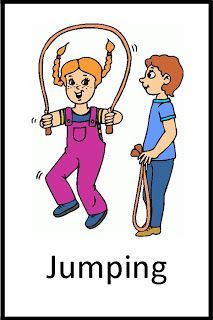 a boy and girl standing next to each other in front of a sign that says jumping