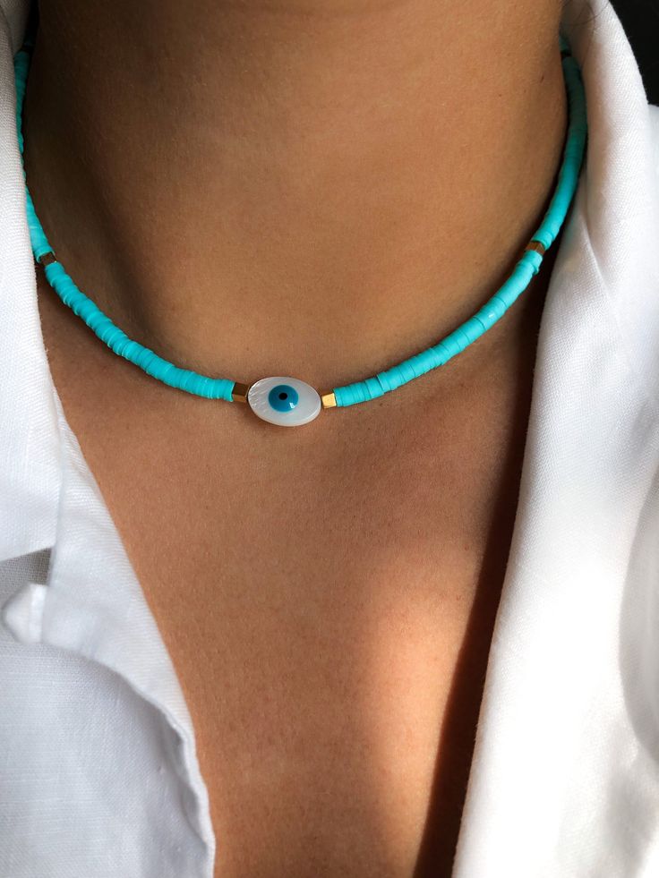 SUMMER DAY (turquoise) * Beaded Enameled Chain (4mm) * Mother of Pearl (Evil Eye) * Golden natural hematite square beads * Total length: 50 cm * Adjustable: yes * Waterproof: yes * Hypoallergenic stainless steel chain and carabiner * Perfect for layering * Goes with any chic outfit * Good vibes only! ➪  𝐴𝑙𝑙 𝑃𝑟𝑜𝑑𝑢𝑐𝑡𝑠 𝑎𝑟𝑒 𝑐𝑎𝑟𝑒𝑓𝑢𝑙𝑙𝑦 𝑝𝑎𝑐𝑘𝑎𝑔𝑒𝑑 𝑤𝑖𝑡ℎ 𝑙𝑜𝑣𝑒.  ➪  𝑃𝑎𝑐𝑘𝑎𝑔𝑒 𝑖𝑛𝑐𝑙𝑢𝑑𝑒𝑠: 𝐼𝑡𝑒𝑚 (𝑜𝑓 𝑐𝑜𝑢𝑟𝑠𝑒), 𝑎 𝑙𝑜𝑣𝑒𝑙𝑦 𝑉𝑒𝑙𝑣𝑒𝑡 𝐺𝑖𝑓𝑡 𝑏𝑎? Turquoise Beaded Necklace For Summer, Summer Turquoise Necklace With Colorful Beads, Blue Necklace For Summer Vacation, Handmade Light Blue Necklaces For Summer, Handmade Light Blue Necklace For Summer, Handmade Light Blue Jewelry For Summer, Turquoise Beaded Necklaces With Round Beads For Summer, Blue Beaded Necklaces For Jewelry Making In Summer, Turquoise Round Bead Jewelry For Beach