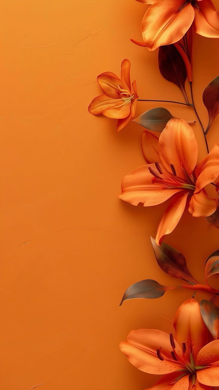 an orange background with flowers and leaves on it