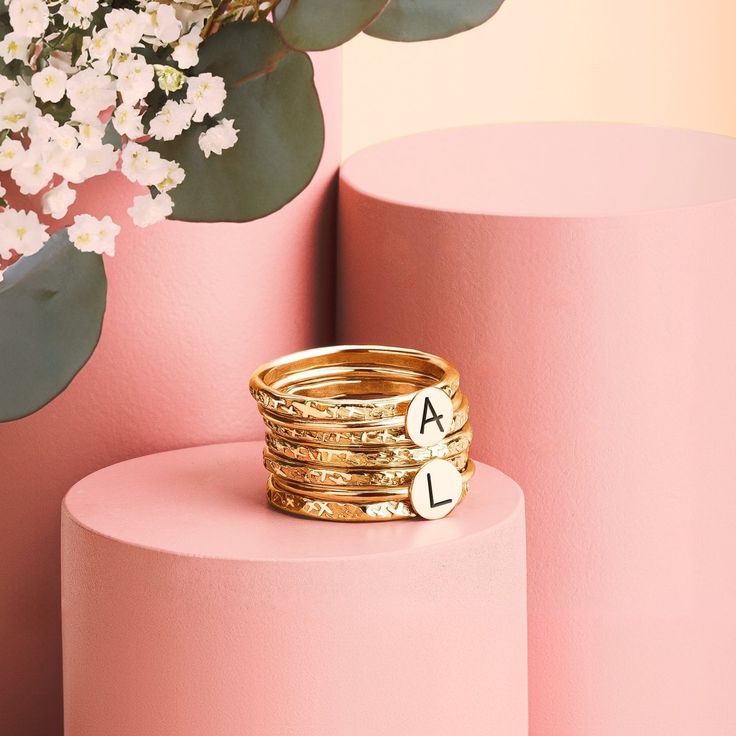 Looking for a unique and special gift? Or maybe you're just treating yourself? Either way, our Initial Stacking Rings Set of 7 in Gold, Silver, or Rose Gold is sure to fit the bill! Personalize these gorgeous rings with any uppercase letter in an arial-style font, making them perfect for representing yourself or your loved ones. The set comes with two initial rings and five heavy weight "Raw Silk" stackers, all in your choice of Sterling Silver, 14K Yellow Gold Fill, or 14K Rose Gold Fill. Stack Stackable Initial Ring With Round Band In Fine Jewelry, Fine Jewelry Stackable Initial Ring With Round Band, Stackable Initial Ring In Yellow Gold And Sterling Silver, Stackable Sterling Silver Initial Ring In Yellow Gold, Yellow Gold Stackable Initial Ring In Sterling Silver, Yellow Gold Sterling Silver Stackable Initial Ring, Stackable Engraved White Gold Ring, Stackable White Gold Engraved Ring In Fine Jewelry Style, Stackable Engraved White Gold Ring In Fine Jewelry Style