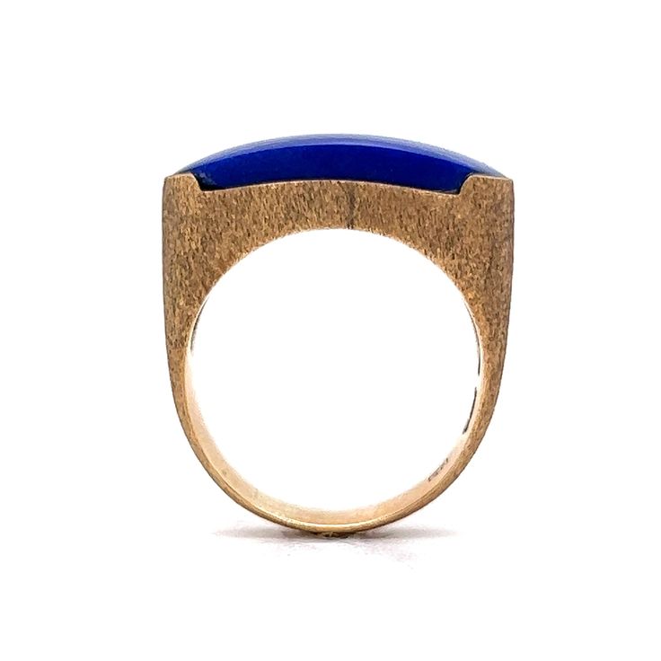 Vibrant Blue Lapis Lazuli! This vintage Mid-Century statement saddle ring features a blue lapis lazuli gemstone in 14 karat yellow gold. Chunky & stylish. The cabochon cut gem resembles the famous Mediterranean blue color in a sleek oval form. The gemstone is set flush on a polished 14 karat yellow gold band. Lapis lazuli have been associated with strength, wisdom, intellect and truth. A one of a kind gift for you or your loved one. Luxury Lapis Lazuli Ring Jewelry, Lapis Lazuli Jewelry Rings, Lapis Stone Ring, Luxury Cabochon Lapis Lazuli Rings, Luxury Lapis Lazuli Cabochon Rings, Luxury Elegant Lapis Lazuli Rings, Luxury Lapis Lazuli Gift Ring, Lapis Lazuli Diamond Ring, Carved Lapis Ring