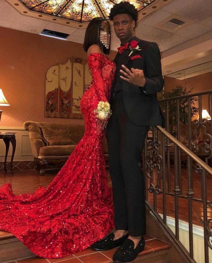 Red dress and black suits wore by a lovely young couple. Kindly visit our Facebook page for more fashion updates. Red Prom Couple Outfit, Red Prom Couple, Prom Couples Outfits, Matching Prom, Prom Inspiration, Prom Couples, African Prom Dresses, Prom Girl Dresses, Senior Prom Dresses