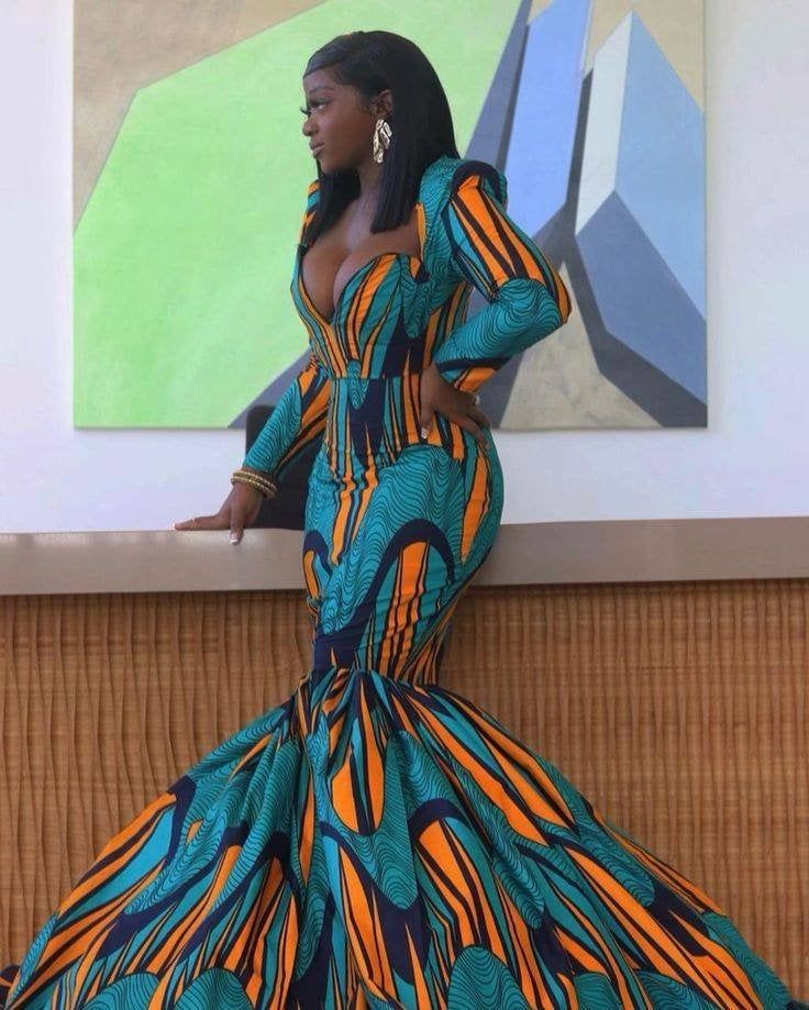 Here's a unique stunning African mermaid dress for You, made with love in Nigeria. Its a long fitted knee-flare dress made with the best quality of African print You can rock this dress confidently to occasions, for wedding, anniversary, events...You'll never go unnoticed in this beautiful piece. This dress is made with over 10yards of fabric to give this volume effect FEATURES African print dress Made with 100% African wax cotton, no stretch, length about 72inches Custom measurements are welcom African Wedding Dress Ankara, Print Wedding Dress, African Prom Dresses Ankara, African Print Wedding Dress, Prom Dress African, African Prom Dress, Wedding Dress Reception, African Mermaid, African Gowns