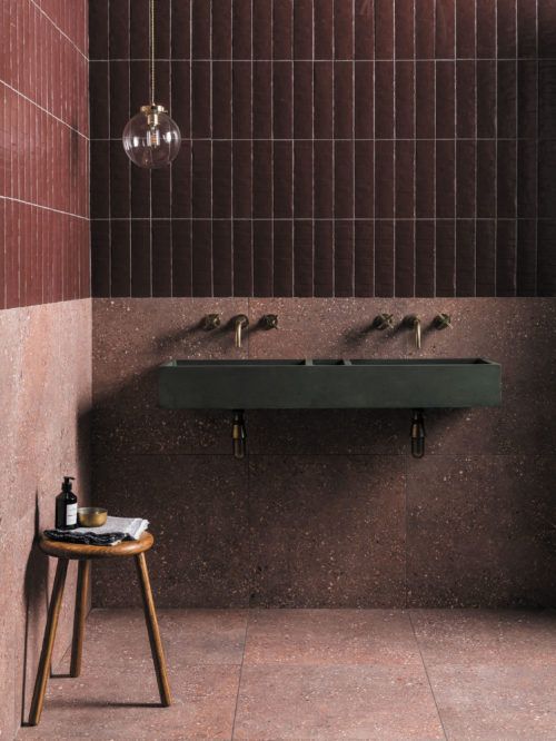 a bathroom with two sinks and a stool