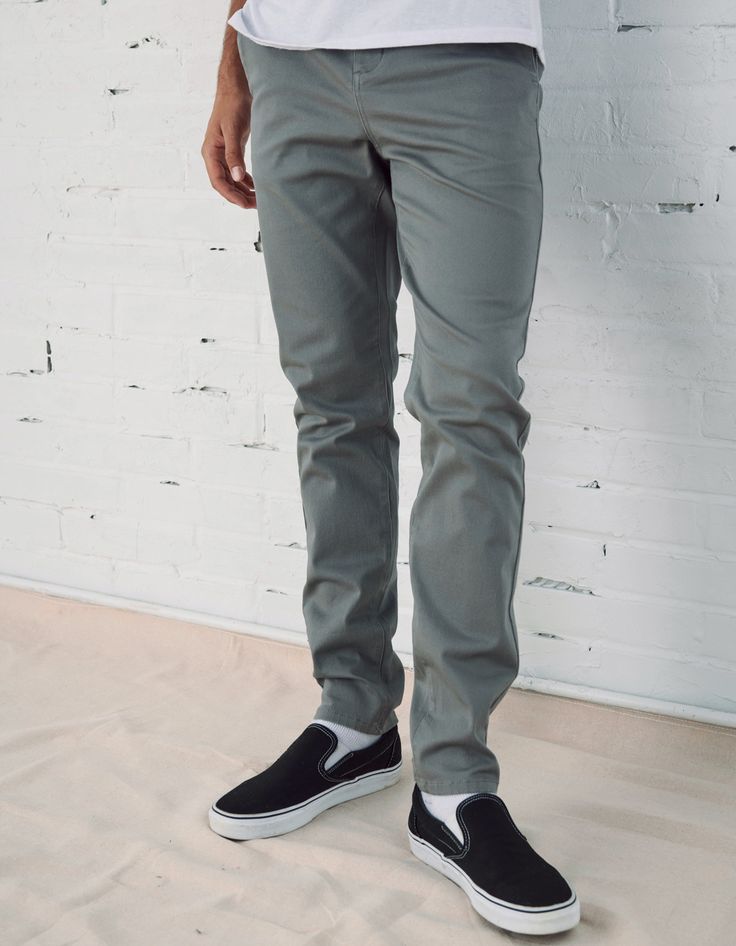 RSQ Skinny Chinos. Formerly known as the "Seattle Skinny Taper Chino Pants". Slant front pockets with welt back pockets and additional decorative pocket with RSQ tag at back left pocket. Approx leg opening: 13.5"(34cm). 97% cotton/3% spandex. Machine wash. Imported.Model is 6'2.5" wearing a size 31x32.Approx outseam: 41"Approx leg opening: 13.5" Casual Non-stretch Cotton Work Pants, Non-stretch Cotton Casual Work Pants, Casual Pants With Button Zip Fly, Casual Full-length Pants With Button Zip Fly, Casual Fitted Pants With Buttons, Fitted Casual Pants With Buttons, Casual Tapered Leg Pants With Buttons, Casual Fitted Straight Work Pants, Casual Non-stretch Straight Work Pants