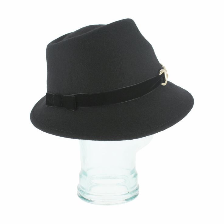 The Italian-made Belfry Zita, with its chic silhouette and charismatic allure, will make a bold statement with any ensemble. This women's trilby features an asymmetrical brim with a velvet hat band trimmed with a gold chain clasp for an elegant touch. Additionally, the inner band offers an adjustable drawstring for customizable fit, ensuring utmost comfort for day-to-day wear. With a reliable wool felt body sure to hold its shape wear after wear, don the Zita and elevate your style with distinct Chic Formal Fedora With Curved Brim, Chic Fedora With Curved Brim For Formal Occasions, Chic Curved Brim Fedora For Formal Occasions, Classic Black Cloche Hat For Party, Chic Fitted Hat With Curved Brim, Chic Fitted Hats With Curved Brim, Adjustable Classic Fedora For Party, Classic Fitted Cloche Fedora, Elegant Fedora For Fall Party