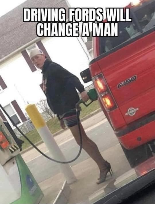 a woman pumping gas into her red truck at a gas station with the caption driving fords will change a man