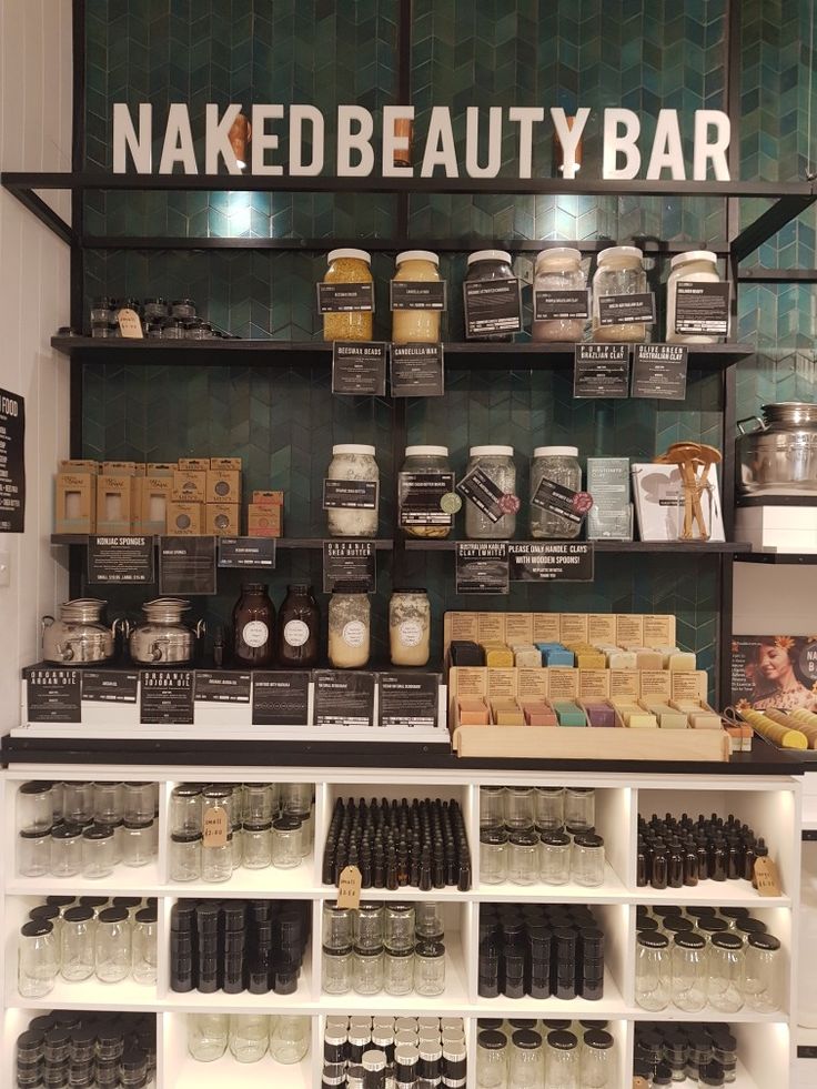 the shelves are filled with different types of beauty products and containers for sale in front of them